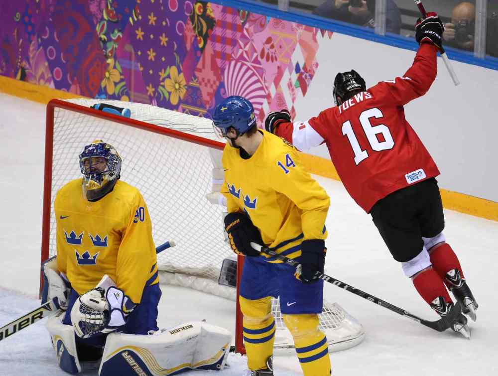 Brian Cassella / Tribune Media MCT
Jonathan Toews waking up a nation with a golden game-winning goal. Winnipeg’s Toews was the most dominant player in the biggest game of the tournament. He checked, he scored and he lifted Canadians out of their church pews, bar stools and easy chairs. The image of him picking up a Canadian flag and skating around the Bolshoy IceDome with a gold medal around his neck will stick in the minds of Canadians and Manitobans forever.