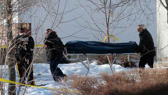 WAYNE GLOWACKI / WINNIPEG FREE PRESS FILESOne of two bodies is removed from the scene of a double homicide at a house in St-Georges, Mb. in 2017.