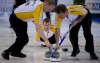 JONATHAN HAYWARD / THE CANADIAN PRESS
Manitoba skip Jeff Stoughton calls a shot as lead Mark Nichols (left) and second Reid Carruthers sweep during the evening draw against Ontario at the Tim Hortons Brier in Edmonton on Sunday.