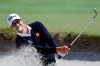 In this Nov. 24, 2013, file photo Adam Scott of Australia hits out of a bunker on the 15th hole during the final round of the World Cup of Golf at Royal Melbourne Golf Course in Melbourne, Australia. Scott will play for the International Team as Royal Melbourne golf course will host the Presidents Cup in December for the third time, and is where the International Team won its only previous tournament against the United States in 1998. (AP Photo/Andy Brownbill, FILE)