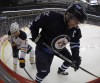 Trevor Hagan / The Canadian Press
Winnipeg Jets' Andrew Ladd, right, and Buffalo Sabres' Linus Omark battle for the puck during second period NHL hockey action in Winnipeg.
