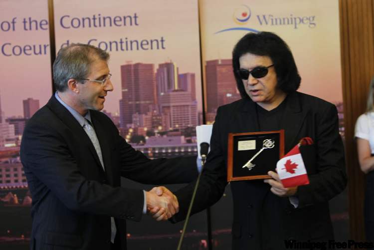 BORIS.MINKEVICH@FREEPRESS.MB.CA
Musician Gene Simmons (right) drew a crowd at city hall. He was given the key to the city by city councillor Gord Steevs.