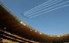 Themba Hadebe / The Associated Press
Planes fly over Soccer City during the opening ceremony.