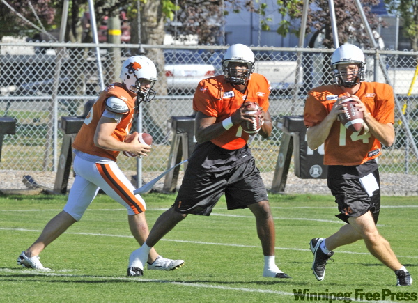 IAN LINDSAY / CANWEST NEWS SERVICE
Casey Printers (centre) with fellow Lion QBs Buck Pierce (left) and Travis Lulay on Tuesday, has earned a bad reputation over the years, but says he really is a team player.