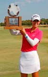 Cheyenne Knight, from Aledo, Texas, holds the trophy after winning the LPGA Volunteers of America golf tournament Sunday, Oct. 6, 2019, at Old American Golf Club in The Colony, Texas.