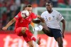 Turkey's forward Kenan Karaman, left, is challenged by France's midfielder Paul Pogba during the Euro 2020 Group H qualifying soccer match between Turkey and France in Konya, Turkey, Saturday June 8, 2019. (AP Photo)