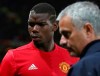 FILE - In this Thursday, Sept. 29, 2016 file photo Manchester United's manager Jose Mourinho, right, with Manchester United's Paul Pogba just prior to the start of Europa League group A soccer match between Manchester United and Zorya Luhansk at Old Trafford, Manchester, England. Manchester United says Jose Mourinho has left the Premier League club with immediate effect. The decision was announced Tuesday Dec.18, 2018, two days after a 3-1 loss to Liverpool left United 19 points off the top of the Premier League after 17 games. (AP Photo/Dave Thompson, File)