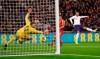 England's Alex Oxlade-Chamberlain, right, scores the opening goal during the Euro 2020 group A qualifying soccer match between England and Montenegro at Wembley stadium in London, Thursday, Nov. 14, 2019. (AP Photo/Kirsty Wigglesworth)