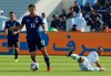 Japan's forward Yoshinori Muto, left, gets away from Saudi Arabia's defender Mohammed Al-Burayk during the AFC Asian Cup round of 16 soccer match between Japan and Saudi Arabia at the Sharjah Stadium in Sharjah, United Arab Emirates, Monday, Jan. 21, 2019. (AP Photo/Hassan Ammar)