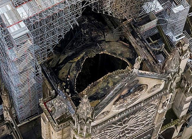 An image made available by Gigarama.ru on Wednesday April 17, 2019 shows an aerial shot of the fire damage to Notre Dame cathedral in Paris on Tuesday April 16. Nearly $1 billion has already poured in from ordinary worshippers and high-powered magnates around the world to restore Notre Dame Cathedral in Paris after it was damaged in a massive fire on Monday. (Gigarama.ru via AP)