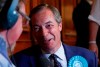 Brexit Party leader Nigel Farage is interviewed after the results were announced at the counting center for the European Elections for the South East England region, in Southampton, England, early Monday, May 27, 2019. (AP Photo/Alastair Grant)