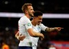 England's Harry Kane celebrates with Jadon Sancho after scoring his side's third goal during the Euro 2020 group A qualifying soccer match between England and Montenegro at Wembley stadium in London, Thursday, Nov. 14, 2019. (AP Photo/Kirsty Wigglesworth)