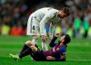 Barcelona forward Lionel Messi, bottom, argues with Real defender Sergio Ramos after a challenge during the Spanish La Liga soccer match between Real Madrid and FC Barcelona at the Bernabeu stadium in Madrid, Saturday, March 2, 2019. (AP Photo/Manu Fernandez)