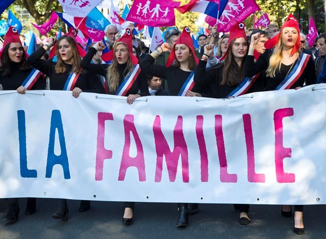 FILE - In this Sunday, Oct. 16, 2016 file photo, demonstrators hold a banner reading