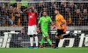 Manchester United's Paul Pogba reacts after his penalty was saved by Wolverhampton Wanderers goalkeeper Rui Patricio during the English Premier League soccer match between Wolverhampton Wanderers and Manchester United at the Molineux Stadium in Wolverhampton, England, Monday, Aug. 19, 2019. (Nick Potts/PA via AP)