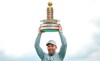 England's Pauls Casey celebrates with the trophy after winning the European Open golf tournament, in Hamburg, Germany, Sunday Sept. 8, 2019. (Axel Heimken/dpa via AP)