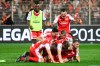 FC Union Berlin players celebrate after the soccer match with VfB Stuttgart in Berlin, Germany, Monday May 27, 2019. FC Union Berlin secured promotion to the Bundesliga. (Joerg Carstensen/dpa via AP)