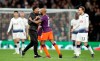 A pitch invader approaches Manchester City's Fabian Delph as Tottenham Hotspur's Christian Eriksen, right, during the Champions League quarter final, first leg match against Manchester City at Tottenham Hotspur Stadium, London, Tuesday April 9, 2019. (Adam Davy/PA via AP)