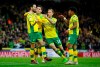 Norwich City's Mario Vrancic, left, celebrates scoring his side's second goal of the game during the English Championship soccer match at Carrow Road, Norwich, England, Saturday April 27, 2019. Norwich is returning to the Premier League after a three-year absence _ and Sheffield United is likely to be promoted, too. Norwich, a club from eastern England, clinched one of the two automatic promotion places from the second-tier League Championship by beating Blackburn 2-1 on Saturday.(Chris Radburn/PA via AP)