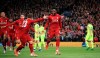 Liverpool's Divock Origi, center, celebrates scoring his side's fourth goal of the game during the Champions League Semi Final, second leg soccer match between Liverpool and Barcelona at Anfield, Liverpool, England, Tuesday, May 7, 2019. (Peter Byrne/PA via AP)