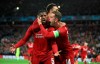 Liverpool's Georginio Wijnaldum, left, celebrates scoring his side's third goal of the game during the Champions League Semi Final, second leg soccer match between Liverpool and Barcelona at Anfield, Liverpool, England, Tuesday, May 7, 2019. (Peter Byrne/PA via AP)