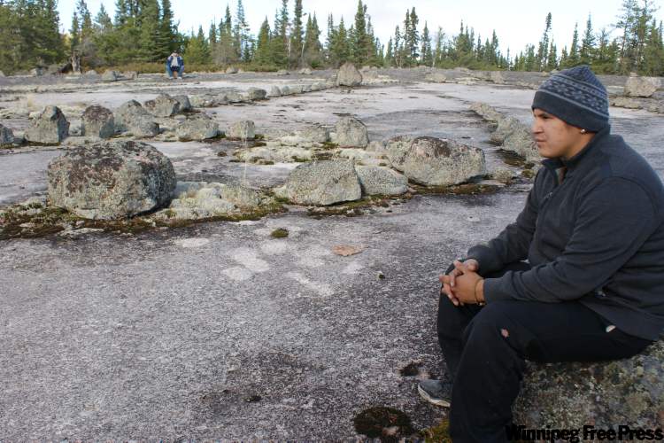 BILL REDEKOP / WINNIPEG FREE PRESS
Tony Bone visits the Tie Creek petroforms. He is rediscovering his aboriginal culture after spending time in prison and being released on probation in July.