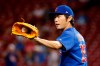 FILE - In this Aug. 23, 2017, file photo, Chicago Cubs relief pitcher Koji Uehara prepares to throw during the eighth inning of the team's baseball game against the Cincinnati Reds in Cincinnati. Uehara, whose dominant season in relief helped the Boston Red Sox win the 2013 World Series, has retired with Japan’s Yomiuri Giants, the team that he first played for in Japan. (AP Photo/John Minchillo, File)
