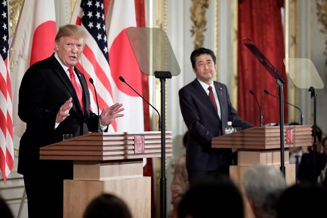 U.S. President Donald Trump, left, speaks as Japanese Prime Minister Shinzo Abe listens during a news conference at Akasaka Palace in Tokyo Monday, May 27, 2019. (Kiyoshi Ota/Pool Photo via AP)