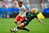 FILE - In this June 21, 2018, file photo, Australia's Aaron Mooy, right, vies for the ball against Denmark's Lasse Schone during the group C match between Denmark and Australia at the 2018 soccer World Cup in the Samara Arena in Samara, Russia. Australia coach Graham Arnold has named injured midfielder Aaron Mooy in his 23-man squad for the Asian Cup, hoping the midfielder can be fit for next month's tournament in the United Arab Emirates. (AP Photo/Martin Meissner, File)