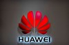 FILE - In this July 4, 2018, file photo, the Huawei logo is seen at a Huawei store at a shopping mall in Beijing. Canadian authorities said Wednesday, Dec. 5, 2018, that they have arrested the chief financial officer of China's Huawei Technologies for possible extradition to the United States. Justice Department spokesman Ian McLeod said Meng Wanzhou was detained in Vancouver, British Columbia, on Saturday, Dec. 2.(AP Photo/Mark Schiefelbein, File)