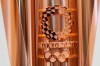 FILE - This March 20, 2019, file photo shows the emblem of the Olympic torch of the Tokyo 2020 Olympic Games during a press conference in Tokyo. Tokyo organizers said Wednesday, May 8, 2019, they are trying to cut spending, under pressure from the International Olympic Committee, which has been widely criticized for driving Olympic cities to build ‚Äúwhite elephant‚Äù venues, often at the taxpayers expense. (AP Photo/Eugene Hoshiko, File)
