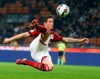 FILE - In this Oct. 26, 2014, file photo, AC Milan's Fernando Torres makes an attempt to score with an acrobatic kick during a Serie A soccer match between AC Milan and Fiorentina, at the San Siro stadium in Milan, Italy. Former Spain striker Torres announced on social media on Friday, June 21, 2019, he is retiring after an 18-year career that included stints at Premier League sides Liverpool and Chelsea and Italy’s AC Milan. (AP Photo/Luca Bruno, File)