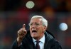 FILE - In this Nov. 15, 2016, file photo, then China's head coach Marcello Lippi gestures during the Group A World Cup 2018 Asian qualifier soccer match against Qatar, in Kunming in southwestern China's Yunnan province. Lippi is set to return for a second stint in charge of China's national team as the country targets a place at the 2022 World Cup, the Chinese Football Association announced Friday, May 24, 2019. (Color China Photo via AP, File)