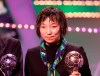 FILE - In this Jan. 24, 2000, file photo, China's Sun Wen, winner of the Golden Ball FIFA Women's World Cup USA 99, stands during the FIFA world player of 1999 gala at the Palais des Congres in downtown Brussels. Former FIFA female player of the year Sun has been elected a vice president of the Chinese Football Association as China seeks to revamp its lagging national program. (AP Photo/Yves Logghe, File)