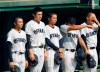 In this July 25, 2019, photo, Ofunato High School pitcher Roki Sasaki, second from left, and teammates cry after they lost to Hanamaki Higashi High School 12-2 in their final baseball game at the Iwate Prefecture qualifier in Morioka, northern Japan. A decision by the high school's manager Yohei Kokubo not to use his star pitcher Sasaki in the final for the prestigious national tournament has the Japanese sporting fraternity up in arms. The gamble ended in defeat, and Ofunato was inundated with phone calls from people demanding an explanation. It sparked harsh criticism of the coach but also a wider debate about the popular tournament’s win-at-all-costs approach, with even Chicago Cubs pitcher Yu Darvish weighing in. (Kyodo News via AP)