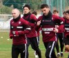 In this Jan. 21, 2019, photo, Vissel Kobe's Andres Iniesta, left, and David Villa, third from left, warm up during their team's training in Kobe, western Japan. Iniesta is hoping the addition of former Barcelona teammate Villa will lead to bigger and better things for his Japanese soccer team this season. (Kyodo News via AP)