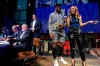 Tennessee Titans running back Derrick Henry laughs with MLS host Susannah Collins before announcing the team's second selection during the Major League Soccer expansion draft Tuesday, Nov. 19, 2019, in Nashville, Tenn. Nashville SC selected Zarek Valentin from the Portland Timbers. (AP Photo/Mark Zaleski)