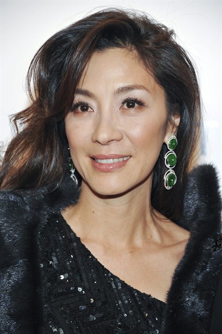 FILE - In this Feb. 9, 2011, file photo, actress Michelle Yeoh attends amfAR's annual New York Gala at Cipriani Wall Street in New York. Officials in Myanmar say the military-backed government has deported Hollywood actress Michelle Yeoh, who stars as pro-democracy leader Aung San Suu Kyi in an upcoming movie. (AP Photo/Evan Agostini, File)