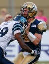 John Woods / The Canadian Press
Blue Bombers quarterback Buck Pierce (4) gets hit late and hard by the Toronto Argonauts' Brandon Isaac (28) in Winnipeg on Saturday.