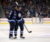 Trevor Hagan / The Canadian Press
Winnipeg Jets' Dustin Byfuglien (33) and Jacob Trouba (8) celebrate after Trouba scored his second goal of the game against the Detroit Red Wings during second period NHL hockey action, in Winnipeg, on Tuesday.