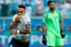 Argentina's Lautaro Martinez, left, celebrates scoring against Qatar during a Copa America Group B soccer match at Arena do Gremio, Porto Alegre, Brazil, Sunday, June 23, 2019. (AP Photo/Victor R. Caivano)
