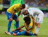 Argentina's Sergio Aguero, right, helps Brazil's Willian during a Copa America semifinal soccer match at Mineirao stadium in Belo Horizonte, Brazil, Tuesday, July 2, 2019. (AP Photo/Eugenio Savio)