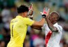 Peru's goalkeeper Pedro Gallese, left, and teammate Luis Advincula celebrate their 3-1 victory over Bolivia in a Copa America Group B soccer match at Maracana stadium in Rio de Janeiro, Brazil, Tuesday, June 18, 2019. (AP Photo/Silvia Izquierdo)