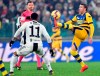 Parma's Antonino Barilla' goes for the ball ahead of Juventus' Douglas Costa, left, during the Serie A soccer match Juventus and Parma at the Allianz stadium in Turin, Italy, Saturday, Feb. 2, 2019. (Alessandro Di Marco/ANSA via AP)