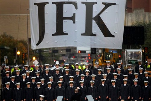 The U.S. Naval Academy Men's Glee Club sings the The Navy Hymn to close out the ceremony to mark the 50th anniversary of the assassination of John F. Kennedy, Friday, Nov. 22, 2013, in Dallas. President Kennedy's motorcade was passing through Dealey Plaza when shots rang out on Nov. 22, 1963. (AP Photo/The Dallas Morning News, Tom Fox) MANDATORY CREDIT; MAGS OUT; TV OUT; INTERNET USE BY AP MEMBERS ONLY; NO SALES