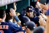 Houston Astros' Jake Marisnick is congratulated in the dugout after hitting a two-run home run against the Seattle Mariners during the second inning of a baseball game Sunday, Sept. 8, 2019, in Houston. (AP Photo/David J. Phillip)