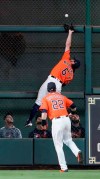 Houston Astros center fielder Jake Marisnick (6) tries to catch a double by Boston Red Sox's Mookie Betts as right fielder Josh Reddick (22) watches during the fourth inning of a baseball game Friday, May 24, 2019, in Houston. (AP Photo/David J. Phillip)