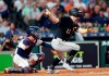 Pittsburgh Pirates' Corey Dickerson (12) hits a two-run single as Houston Astros catcher Robinson Chirinos watches during the third inning of a baseball game Wednesday, June 26, 2019, in Houston. (AP Photo/David J. Phillip)