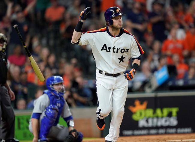 Houston Astros' Josh Reddick tosses his bat after hitting a home run against the Seattle Mariners during the eighth inning of a baseball game Friday, June 28, 2019, in Houston. (AP Photo/David J. Phillip)
