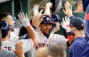 Houston Astros' Yuli Gurriel, center, celebrates with teammates in the dugout after hitting a home run against the Los Angeles Angels during the sixth inning of a baseball game Saturday, July 6, 2019, in Houston. (AP Photo/David J. Phillip)